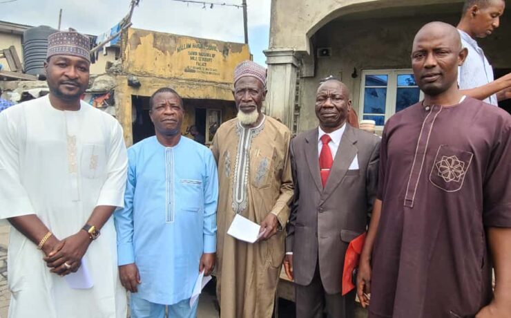 Group photograph taken with Alhaji Ibrahim Badamasi in Mile 12 Market, Lagos State Nigeria.